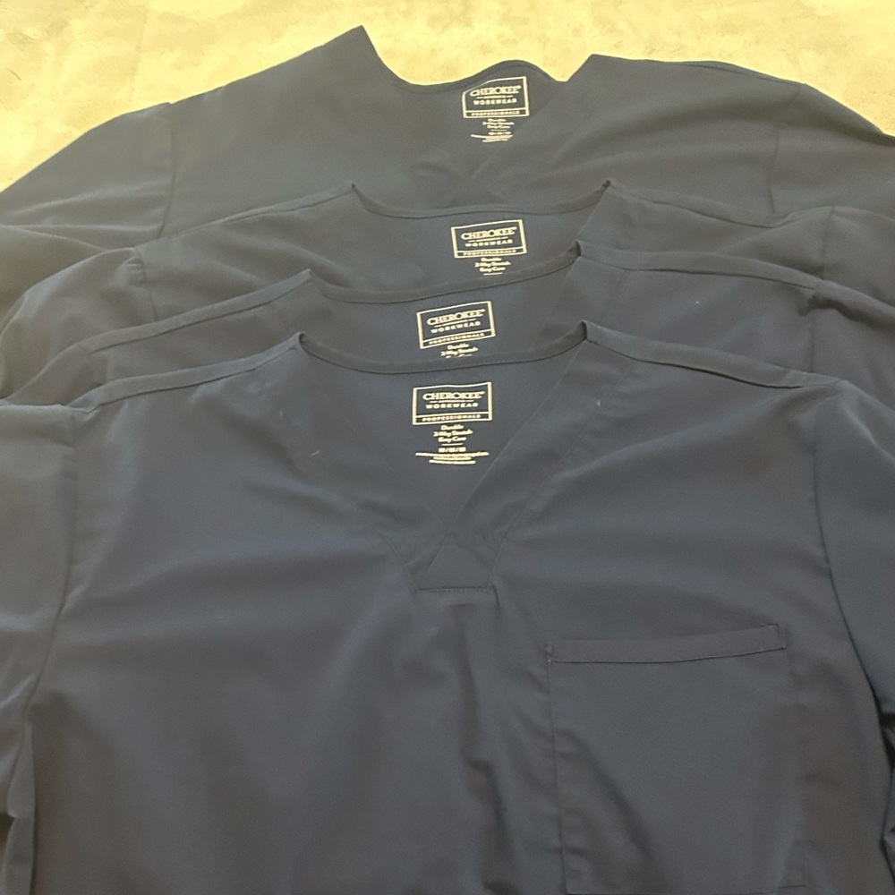 Cherokee workwear scrub tops and pants. 4 pairs each. All medium in size.